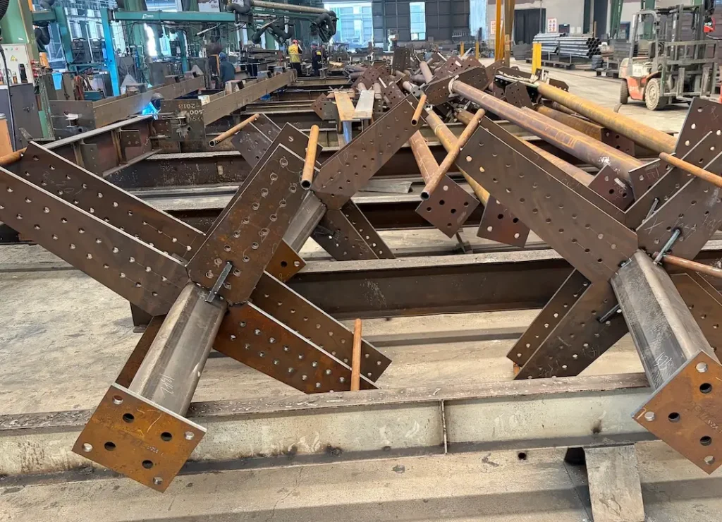 Custom welded parts with steel tube columns and welded connection plates